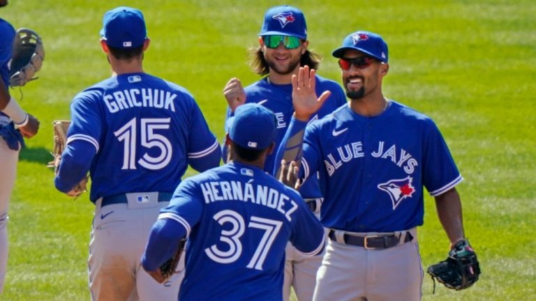Toronto Blue Jays celebrate a 3-1 victory over the New York Yankees in a baseball game Sunday, April 4, 2021, at Yankee Stadium in New York. From left are right fielder Randal Grichuk (15), left fielder Teoscar Hernandez (37), shortstop Bo Bichette and second baseman Marcus Semien. (Kathy Willens/AP)