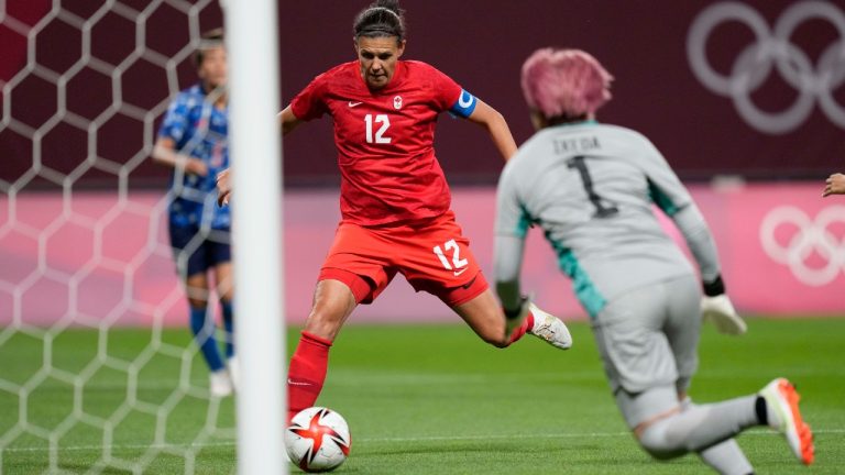 Canada's Christine Sinclair (12) scores a goal against Japan at the 2020 Summer Olympics, Wednesday, July 21, 2021, in Sapporo, Japan. (Silvia Izquierdo/AP)