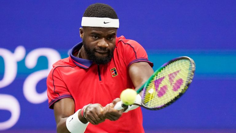 Frances Tiafoe, of the United States, returns against Felix Auger-Aliassime, of Canada, during the fourth round of the U.S. Open tennis championships, Sunday, Sept. 5, 2021, in New York. (Frank Franklin II/AP)