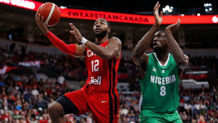 Canada's Aaron Best (12) get clear and takes the shot against Nigeria's Ekpe Udoh (8) during the first half of their exhibition game in Winnipeg, Friday, August 9, 2019 (John Woods/CP).
