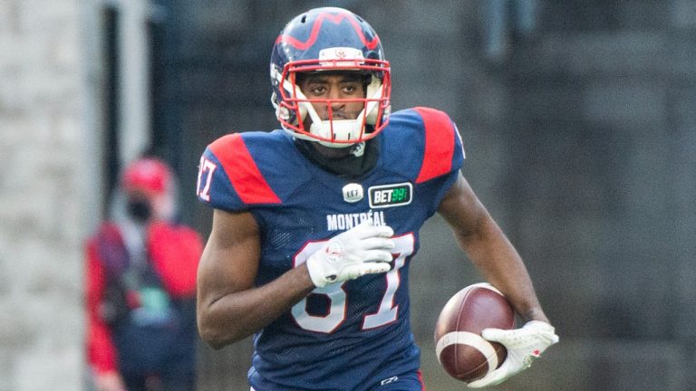 Montreal Alouettes' Eugene Lewis runs with the ball after scoring a touchdown against the Winnipeg Blue Bombers during first half CFL football action in Montreal, Saturday, Nov. 13, 2021. (Graham Hughes/THE CANADIAN PRESS) 
