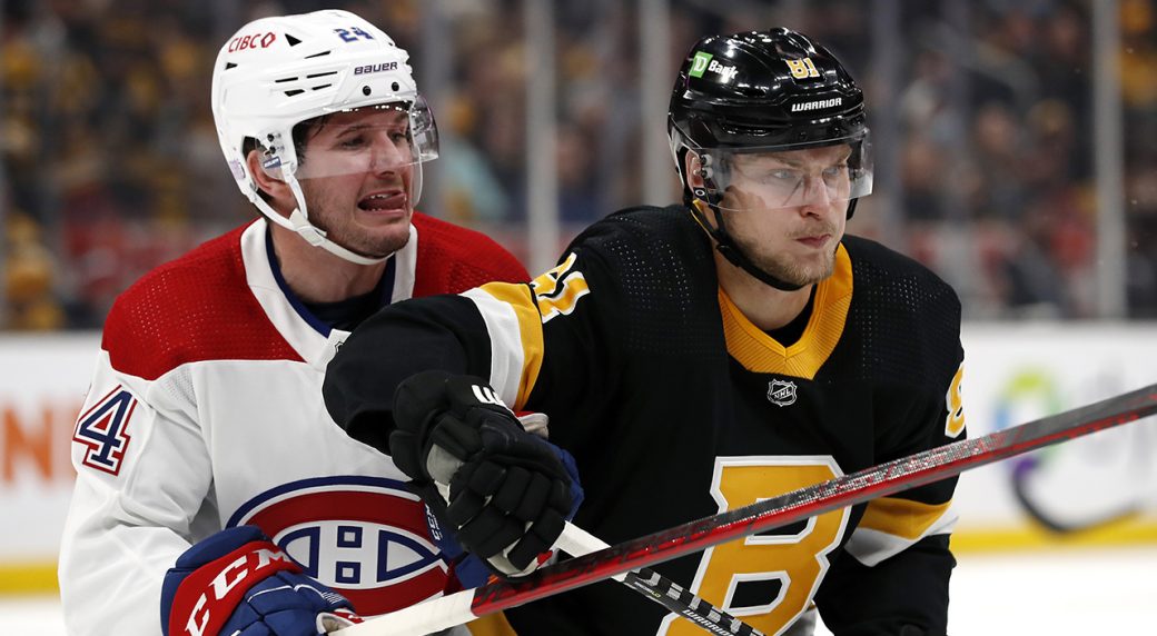 Boston Bruins' Anton Blidh (81) battles Montreal Canadiens' Adam Brooks