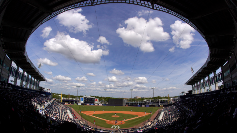 Socially distanced fans watch a spring training exhibition baseball game between the Philadelphia Phillies and the New York Yankees at George M. Steinbrenner Field in Tampa, Fla., Monday, March 15, 2021. (AP) 