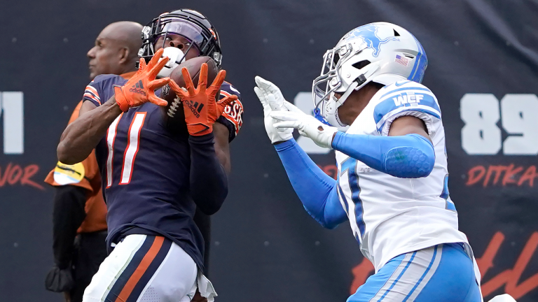 Chicago Bears wide receiver Darnell Mooney (11) catches a pass from quarterback Justin Fields as Detroit Lions defensive back Bobby Price defends during the second half on Sunday, Oct. 3, 2021, in Chicago. (AP)