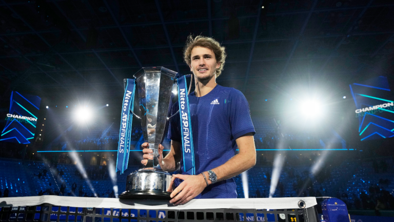 Alexander Zverev of Germany poses with his trophy after winning the singles final tennis match of the ATP World Tour Finals, at the Pala Alpitour in Turin, Italy, Sunday, Nov. 21, 2021. Zverev defeated Daniil Medvedev of Russia 6-4/6-4.(AP Photo/Luca Bruno) 
