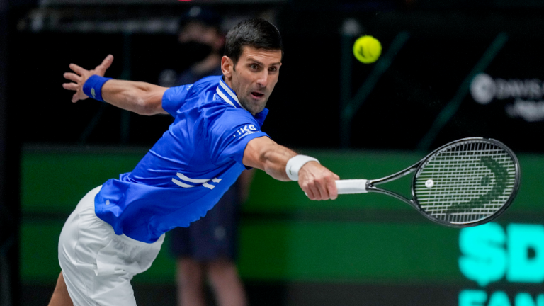 Serbia's Novak Djokovic hits a backhand against Austria's Dennis Novak during a Davis Cup group F match between Serbia and Austria in Innsbruck, Austria, Friday, Nov. 26, 2021. (Photo/Michael Probst) 
