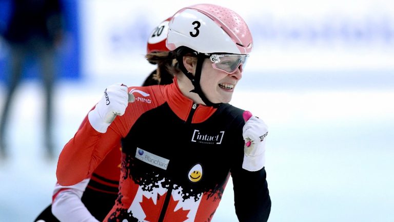 Canada's Kim Boutin, front, celebrates as she crosses the finish line of the women's 500 meters final race at the World Cup short track speed skating championship in Dresden, eastern Germany, Sunday, Feb. 9, 2020. (Jens Meyer/AP)