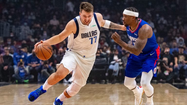 Dallas Mavericks guard Luka Doncic (77) gets past Los Angeles Clippers guard Eric Bledsoe (12) during the first half of an NBA basketball game Tuesday, Nov. 23, 2021, in Los Angeles. (John McCoy/AP)