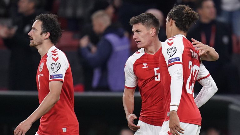 Denmark's Joakim Maehle, centre, celebrates scoring with teammates Thomas Delaney, left, and Yussuf Poulsen during the World Cup group F qualifying soccer match. (Liselotte Sabroe/Ritzau Scanpix via AP)