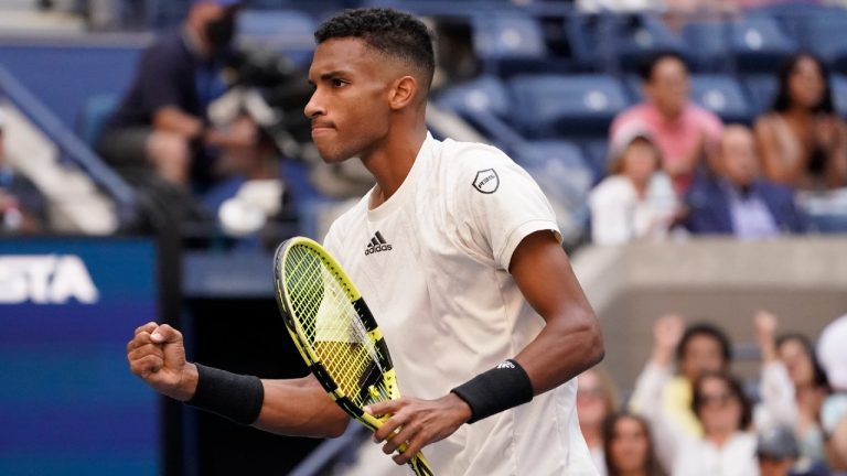 Felix Auger-Aliassime, of Canada, reacts after scoring a point. (John Minchillo/AP)
