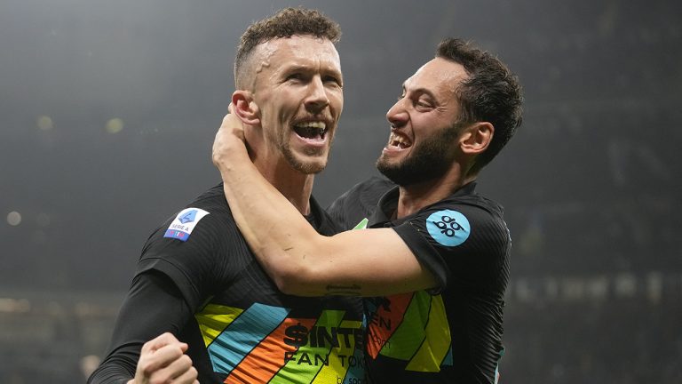 Inter Milan's Ivan Perisic, left, celebrates with his teammate Hakan Calhanoglu after he scored his side's second goal celebrates after he scored his side's second goal during the Serie A soccer match between Inter Milan and Napoli at San Siro Stadium. (Antonio Calanni/AP)