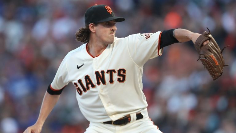 San Francisco Giants' Kevin Gausman pitches against the Los Angeles Dodgers during the first inning of Game 2 of a baseball National League Division Series Saturday, Oct. 9, 2021, in San Francisco. (AP Photo/Jed Jacobsohn)
