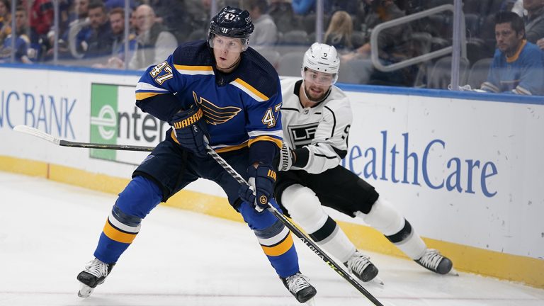 St. Louis Blues' Torey Krug (47) controls the puck as Los Angeles Kings' Adrian Kempe (9) defends during the first period of an NHL hockey game. (Jeff Roberson/AP)