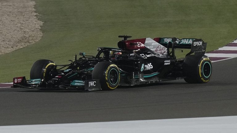 Mercedes driver Lewis Hamilton of Britain leads at the start of the Qatar Formula One Grand Prix. In Lusail, Qatar. (Darko Bandic/AP)