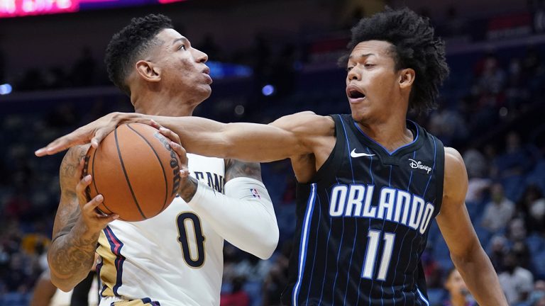 New Orleans Pelicans guard DiDi Louzada (0) goes to the basket as Orlando Magic guard Jeff Dowtin (11) defends during the second half of an NBA basketball preseason game. (Gerald Herbert/AP)