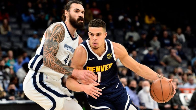 Denver Nuggets forward Michael Porter Jr. (1) handles the ball against Memphis Grizzlies center Steven Adams (4) in the first half of an NBA basketball game Monday, Nov. 1, 2021, in Memphis, Tenn (Brandon Dill/AP).