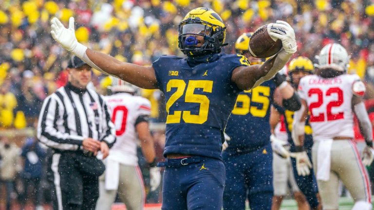 Michigan running back Hassan Haskins (25) celebrates a touchdown in the fourth quarter of an NCAA college football game against Ohio State in Ann Arbor, Mich., Saturday, Nov. 27, 2021. Michigan won 42-27. (Tony Ding/AP)