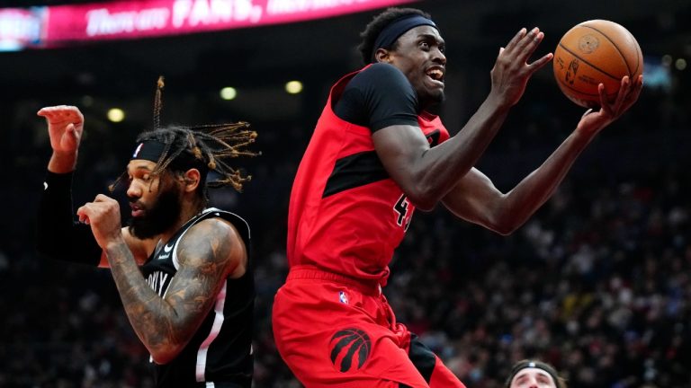 Toronto Raptors forward Pascal Siakam (43) goes to the net past Brooklyn Nets guard DeAndre' Bembry (95) during first half NBA basketball action in Toronto on Sunday, Nov. 7, 2021. (Frank Gunn/CP)