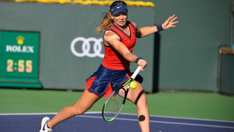 Paula Badosa, of Spain, returns a volley while playing Victoria Azarenka, of Belarus, in singles at the BNP Paribas Open tennis tournament Sunday, Oct. 17, 2021, in Indian Wells, Calif. (John McCoy/AP).
