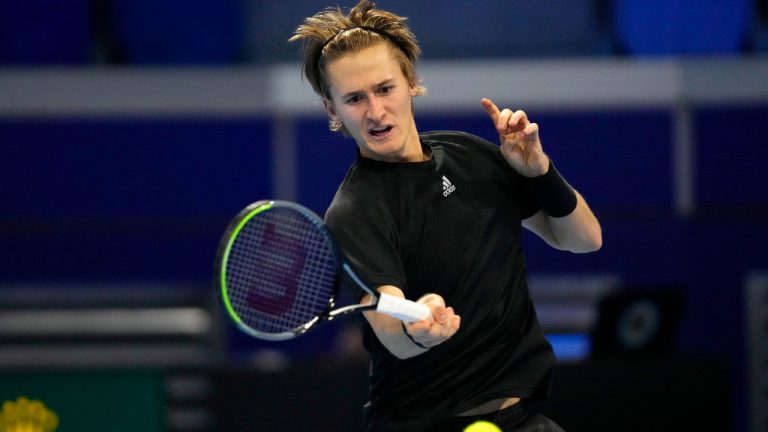 United States' Sebastian Korda returns the ball to France's Hugo Gaston during the ATP Next Gen tennis tournament in Milan, Italy, Tuesday, Nov. 9, 2021 (Antonio Calanni/AP).