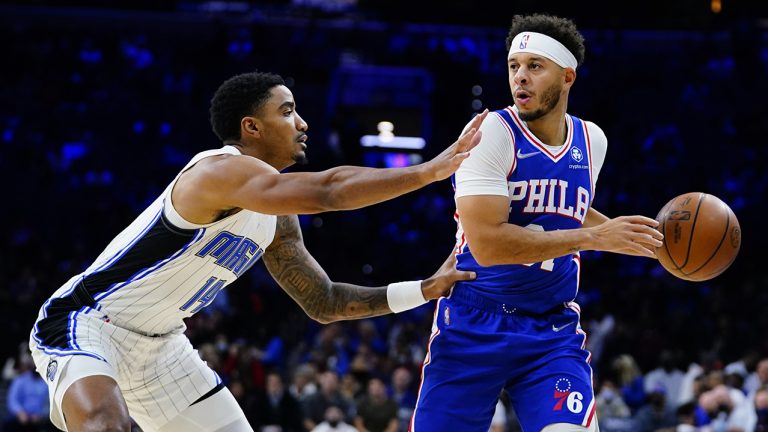 Philadelphia 76ers' Seth Curry, right, tries to get past Orlando Magic's Gary Harris during the first half of an NBA basketball game, Monday, Nov. 29, 2021, in Philadelphia. (Matt Slocum/AP Photo)