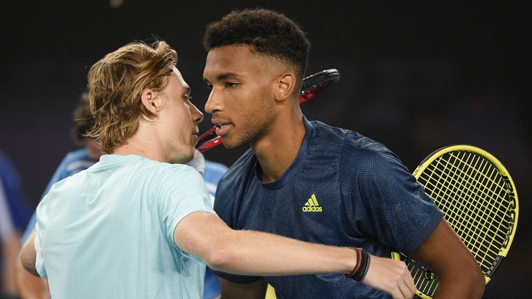 Canada's Felix Auger-Aliassime, right, is congratulated by compatriot Denis Shapovalov after winning their third round match at the Australian Open tennis championship. (Andy Brownbill/AP)