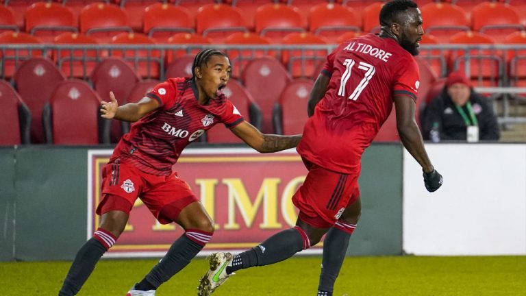 Toronto FC midfielder Jahkeele Marshall-Rutty (7) and Toronto FC forward Jozy Altidore (17) celebrate a goal against the Philadelphia Union during second half MLS action in Toronto on Wednesday, October 27, 2021 (Evan Buhler/CP).
