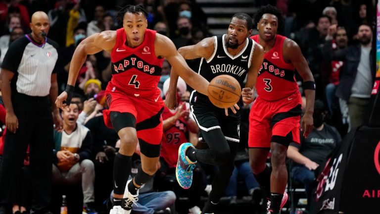 Toronto Raptors forward Scottie Barnes (4) drives up the court after stealing the ball from Brooklyn Nets forward Kevin Durant (7) during first half NBA basketball action in Toronto on Sunday, Nov. 7, 2021. (Frank Gunn/CP)