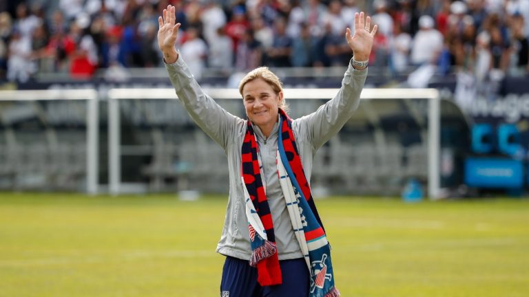 Former United States head coach Jill Ellis waves to the crowd as she leaves the field after an international friendly soccer match between the United States and South Korea in 2019. (Kamil Krzaczynski/AP)