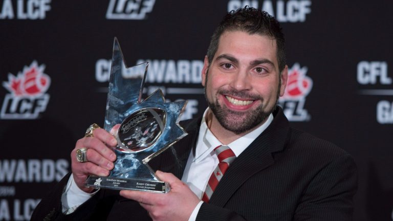 Randy Chevrier of the Calgary Stampeders celebrates his Tom Pate Memorial award during the CFL Awards in Vancouver, B.C. Thursday, Nov. 27, 2014. (Jonathan Hayward/THE CANADIAN PRESS)