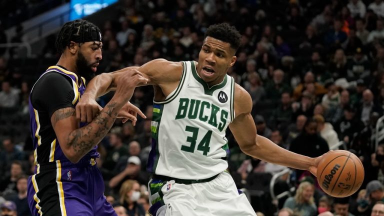 Milwaukee Bucks' Giannis Antetokounmpo tries to get past Los Angeles Lakers' Anthony Davis during the second half of an NBA basketball game Wednesday, Nov. 17, 2021, in Milwaukee. The Bucks won 109-102. (Morry Gash/AP)