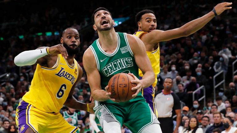 Boston Celtics' Enes Kanterm center, looks to shoot in front of Los Angeles Lakers' LeBron James (6) during the first half of an NBA basketball game. (Michael Dwyer/AP) 