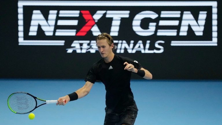 United States' Sebastian Korda returns the ball to United States' Brandon Nakashima during the ATP Next Gen semifinal tennis tournament in Milan, Italy, Friday, Nov. 12, 2021. (Antonio Calanni/AP)