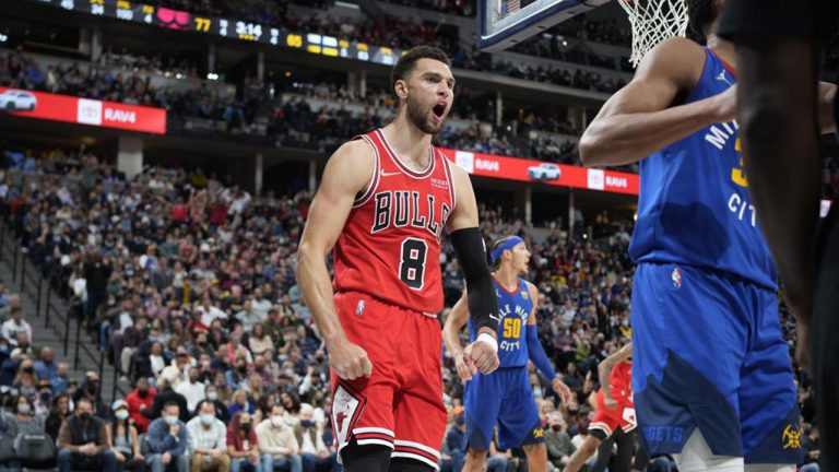 Chicago Bulls guard Zach LaVine reacts after dunking against the Denver Nuggets in the second half of an NBA basketball game. (David Zalubowski/AP)