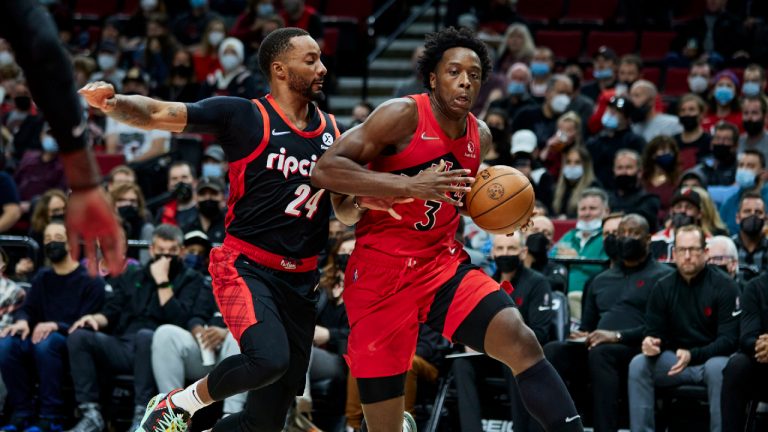 Toronto Raptors forward OG Anunoby, right, drives to the basket as Portland Trail Blazers forward Norman Powell defends during the first half of an NBA basketball game in Portland, Ore., Monday, Nov. 15, 2021. (Craig Mitchelldyer/AP)