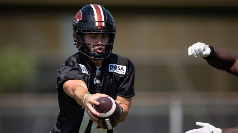 B.C. Lions quarterback Nathan Rourke fakes a handoff during practice at the CFL team's facility in Surrey, B.C., on Tuesday, August 3, 2021. (Darryl Dyck/THE CANADIAN PRESS) 
