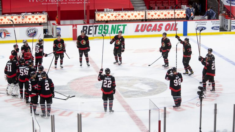 Ottawa Senators players stand at centre ice following their final game of the regular season against the Toronto Maple Leafs. (Adrian Wyld/CP)