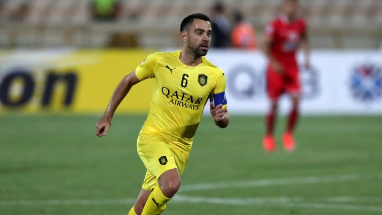 FILE - In this file photo dated Monday, May 20, 2019, Qatar's Al-Sadd player Xavi Hernandez, former Barcelona and Spain midfielder, controls the ball during an AFC Champions League match at the Azadi stadium in Tehran, Iran. Spain great Xavi Hernandez said Saturday Jan. 11, 2020, that for now he is committed to coaching his team in Qatar amid rumours that former club Barcelona has probed him about becoming its next coach. (Vahid Salemi/AP Photo)