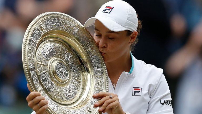 FILE - Australia's Ashleigh Barty poses with the trophy for the media after winning the women's singles final after defeating the Czech Republic's Karolina Pliskova on day twelve of the Wimbledon Tennis Championships in London, Saturday, July 10, 2021. Wimbledon champion Ash Barty finished No. 1 in the WTA singles rankings for the third consecutive season, while Katerina Siniakova topped the doubles rankings for the second time. Barty, a 25-year-old from Australia, joins Serena Williams, Steffi Graf, Martina Navratilova and Chris Evert as the only women to lead the year-end tennis rankings three straight times (Pete Nichols/AP)