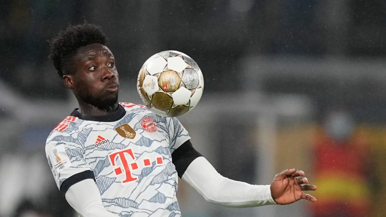 Bayern's Alphonso Davies controls the ball in the air during the German Supercup soccer match between Borussia Dortmund and Bayern Munich in Dortmund, Germany, Tuesday, Aug. 17, 2021. (Martin Meissner/AP) 