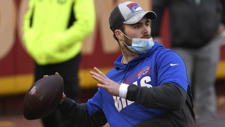 (Then)Buffalo Bills quarterback Jake Fromm warms up before the AFC championship NFL football game against the Kansas City Chiefs, Sunday, Jan. 24, 2021, in Kansas City, Mo. (Reed Hoffmann/AP)