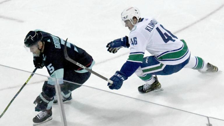 Seattle Kraken's Mark Giordano skates past Vancouver Canucks' Danila Klimovich during a pre-season game at the Spokane Arena on Sunday, Sept. 26, 2021, in Spokane, Wash. (AP/file)