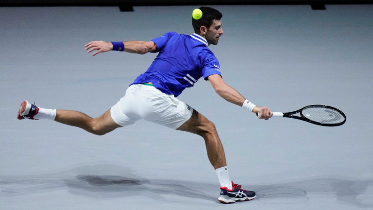 Serbia's Novak Djokovic returns the ball to Croatia's Marin Cilic during their Davis Cup semi-final action at Madrid Arena on Friday. (AP)