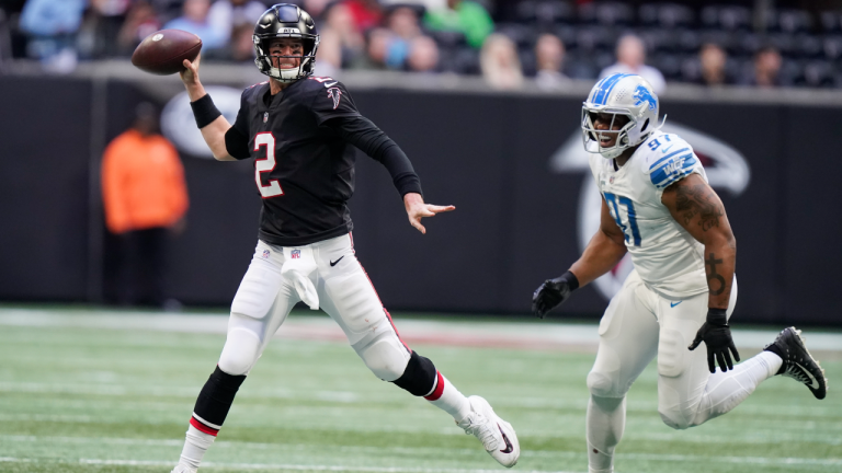 Atlanta Falcons quarterback Matt Ryan passes the ball under pressure from Detroit Lions defensive end Nick Williams (97) during the second half on Sunday. (AP)