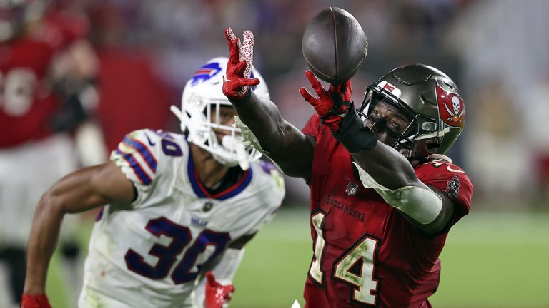 Tampa Bay Buccaneers wide receiver Chris Godwin (14) can't reach a pass from quarterback Tom Brady after getting past Buffalo Bills cornerback Dane Jackson (30). (Mark LoMoglio/AP)