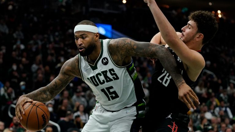 Milwaukee Bucks' DeMarcus Cousins tries to get past Houston Rockets' Alperen Sengun during the second half of an NBA basketball game Wednesday, Dec. 22, 2021, in Milwaukee. (Morry Gash/AP)