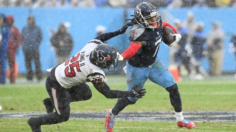 Tennessee Titans running back D'Onta Foreman (7) tries to get past Houston Texans cornerback Desmond King (25) in the first half of an NFL football game Sunday, Nov. 21, 2021, in Nashville, Tenn. (Mark Zaleski/AP) 