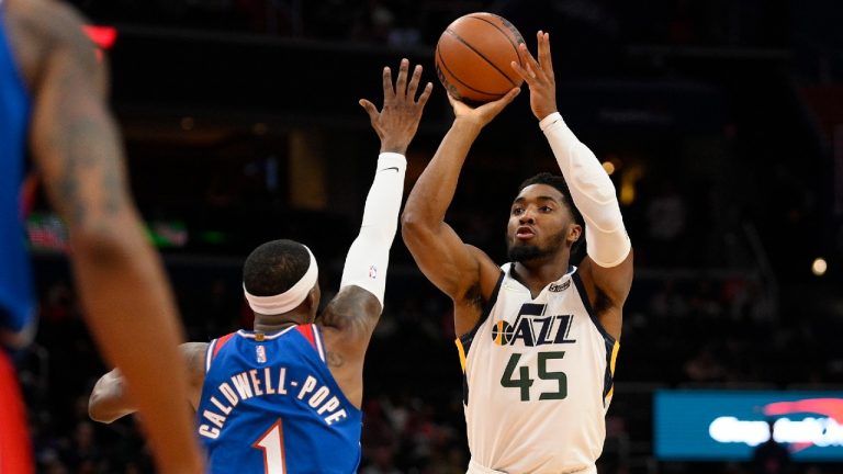 Utah Jazz guard Donovan Mitchell (45) shoots against Washington Wizards guard Kentavious Caldwell-Pope (1) during the first half of an NBA basketball game Saturday, Dec. 11, 2021, in Washington (Nick Wass/AP).