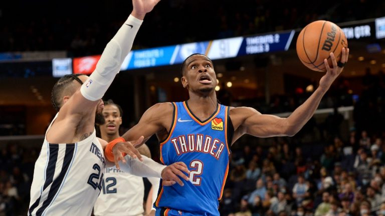 Oklahoma City Thunder guard Shai Gilgeous-Alexander (2) handles the ball against Memphis Grizzlies forward Dillon Brooks (24) in the second half of an NBA basketball game Monday, Dec. 20, 2021, in Memphis, Tenn. (Brandon Dill/AP) 