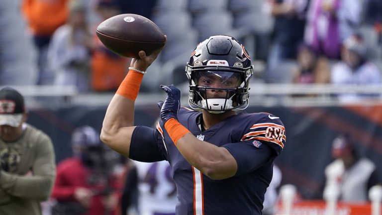 Chicago Bears quarterback Justin Fields warms up before an NFL football game against the Baltimore Ravens. (Charles Rex Arbogast/AP)